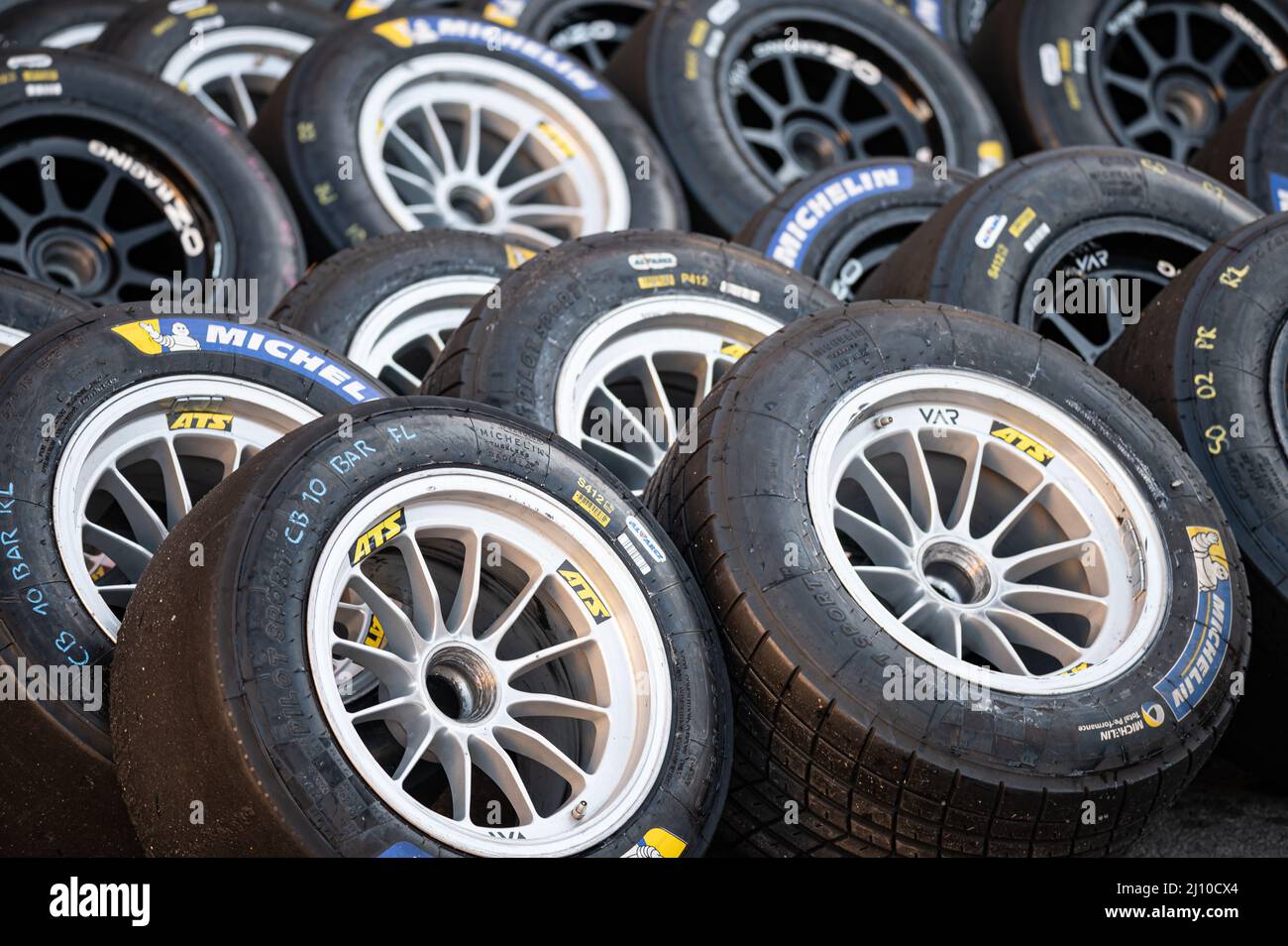 Closeup of the racing wheels on the racing circuit Stock Photo