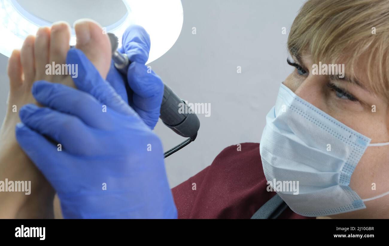 Patient on medical pedicure procedure, visiting podiatrist.Professional