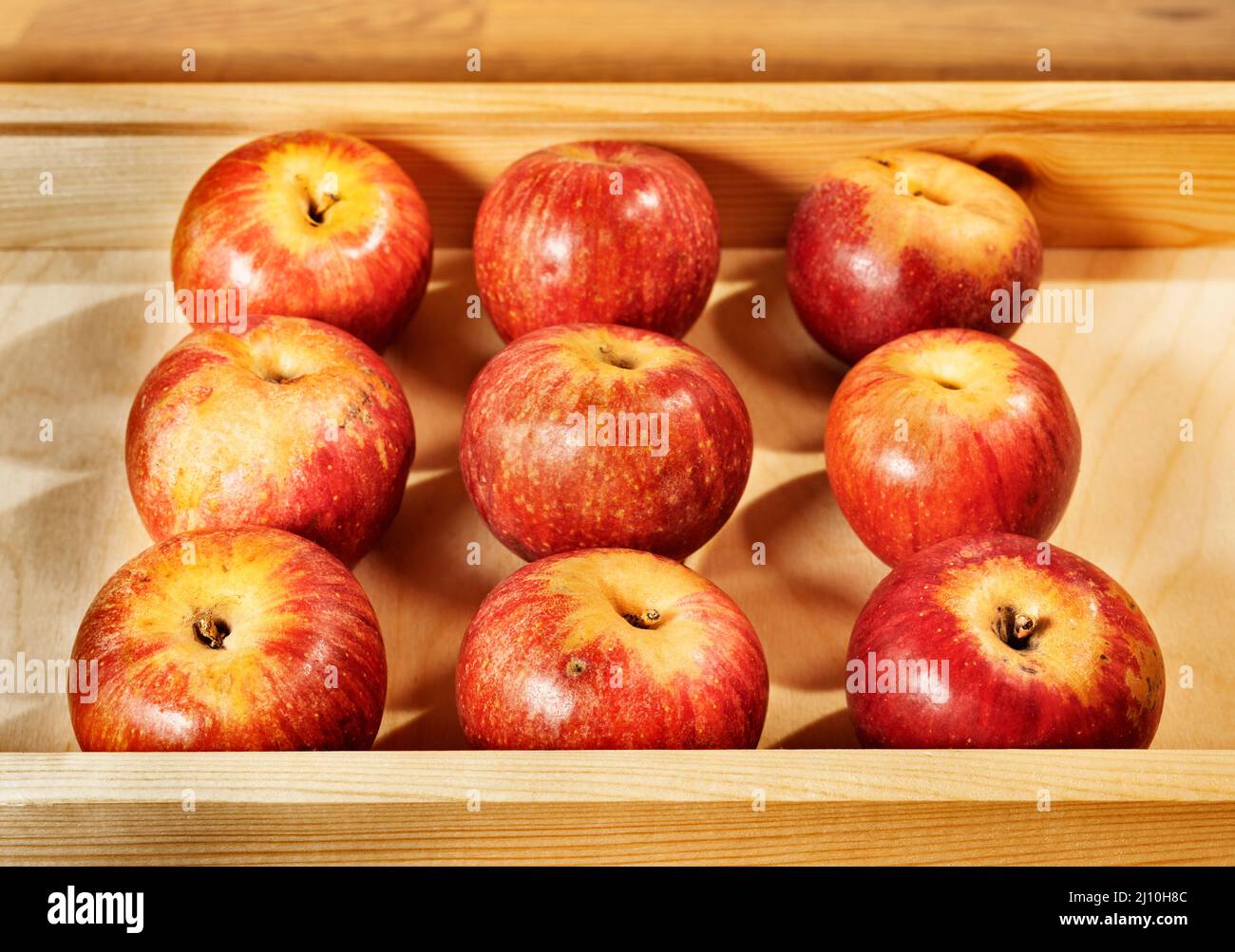 Wooden crate with red ripe Annurca apples ,apple to Southern Italy Stock Photo