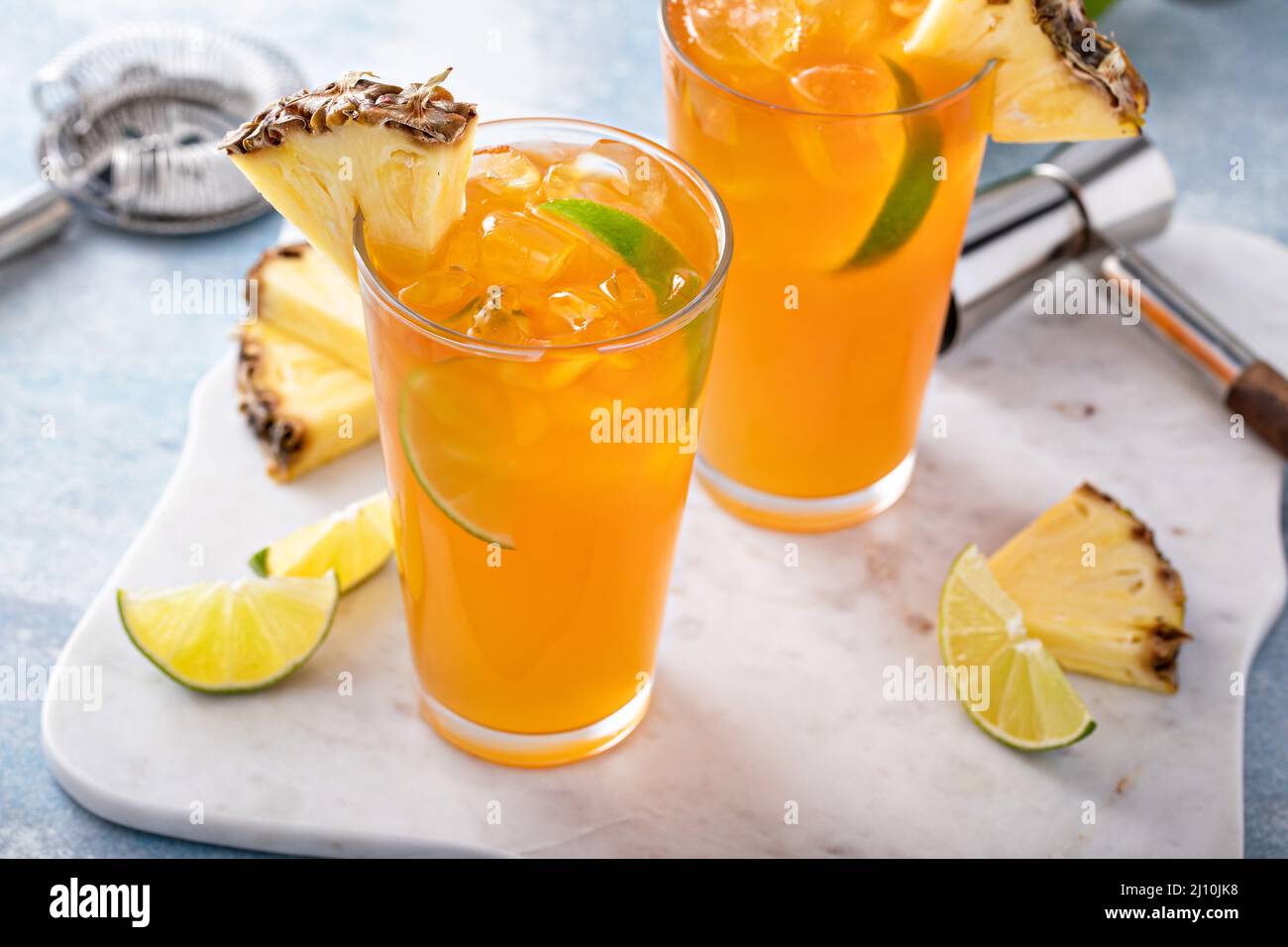 Pineapple rum cocktail with lime slices, refreshing summer cocktail ...