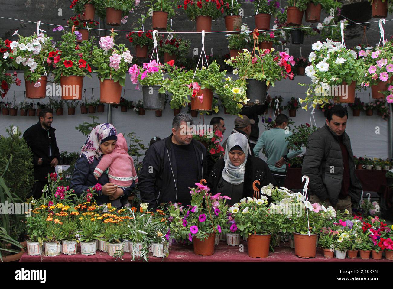 Gaza. 21st Mar, 2022. People visit an exhibition for plants and flowers at the Islamic University, in Gaza City, on March 21, 2022. Credit: Rizek Abdeljawad/Xinhua/Alamy Live News Stock Photo