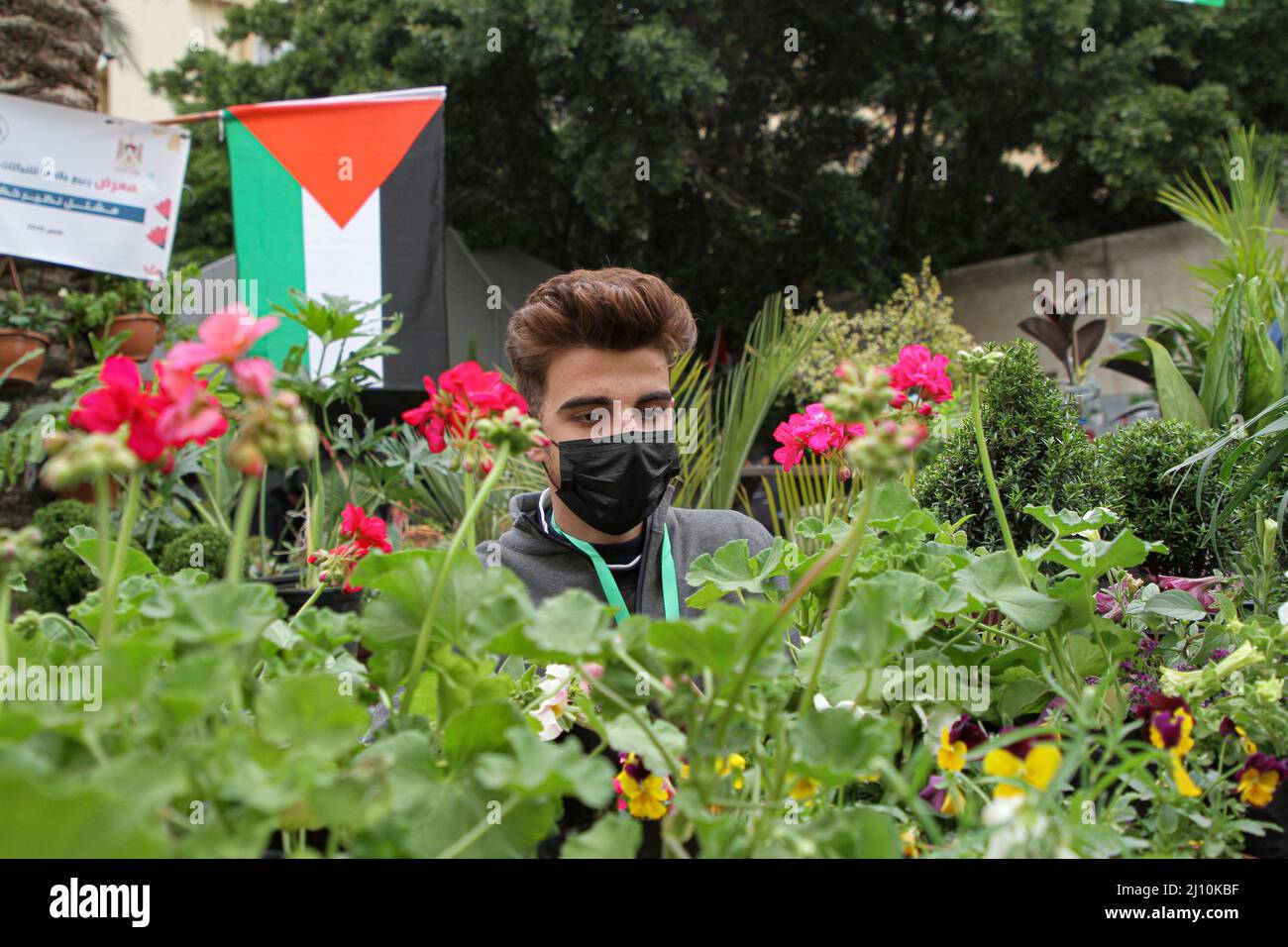 Gaza. 21st Mar, 2022. A man participates in an exhibition for plants and flowers at the Islamic University, in Gaza City, on March 21, 2022. Credit: Rizek Abdeljawad/Xinhua/Alamy Live News Stock Photo