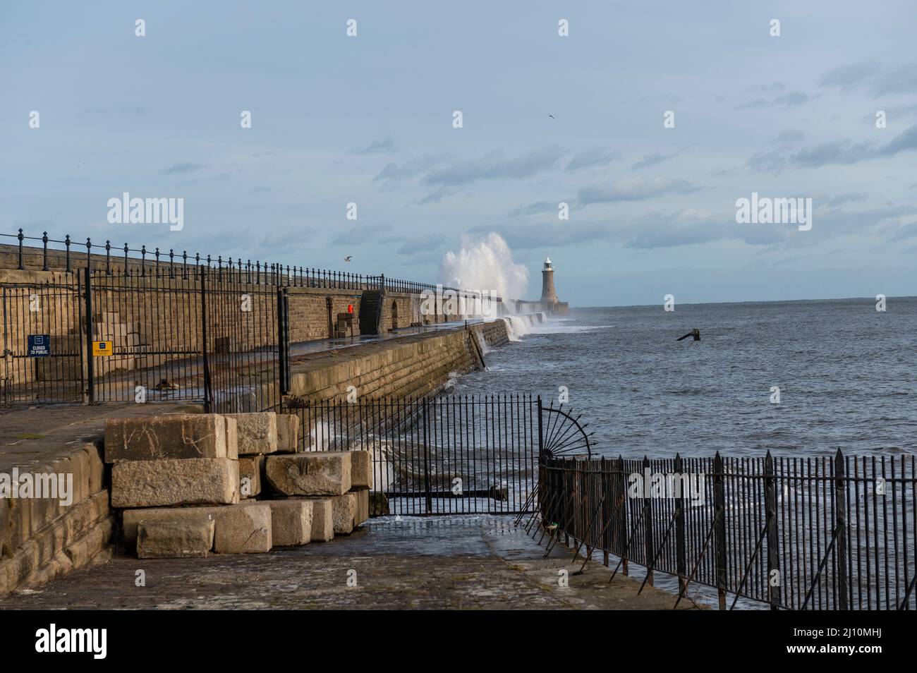 Tynemouth North Pier being hit by big waves Stock Photo