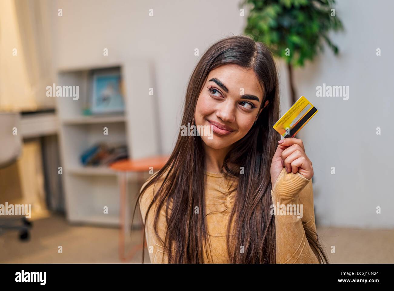 Joyful Brunette Girl Preparing To Go Shopping While Using Her Credit joyful-brunette-girl-preparing-to-go-shopping-while-using-her-credit