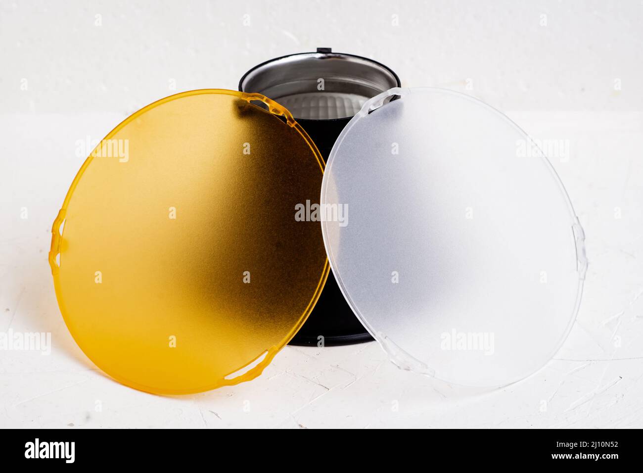 Standard reflector with matt white and yellow diffuser on a white background. Different