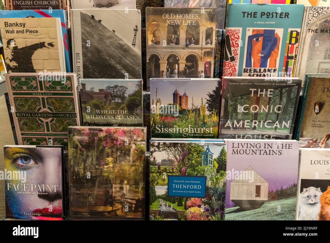 Various books for sale on stand in bookshop Stock Photo