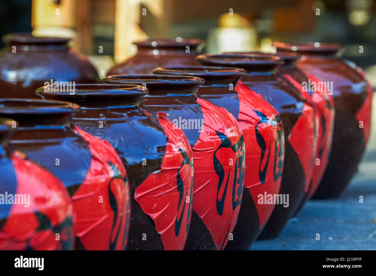 Close-up of a neat row of Chinese liquor jars Stock Photo