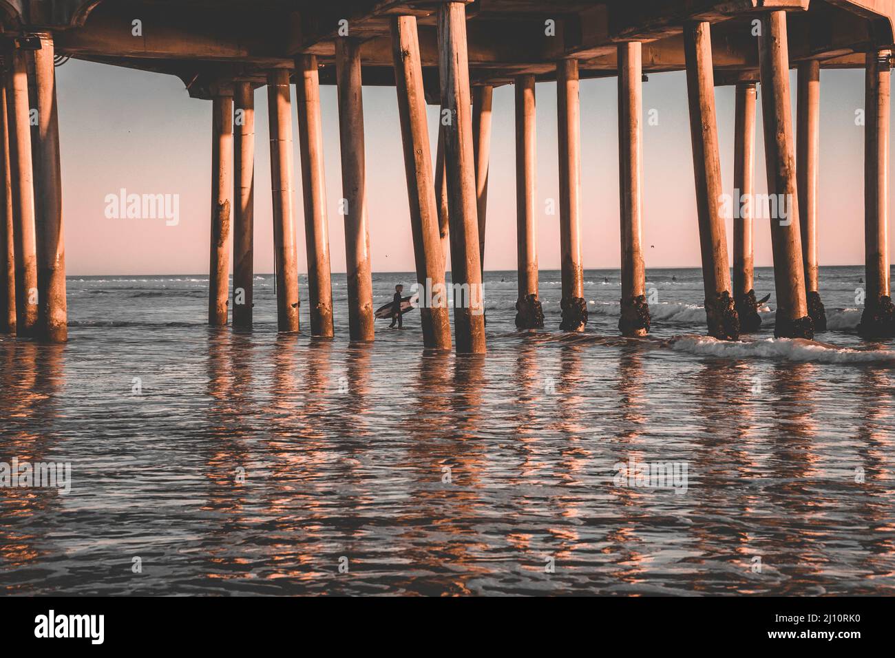Ocean waves crashing under wooden hi-res stock photography and images ...