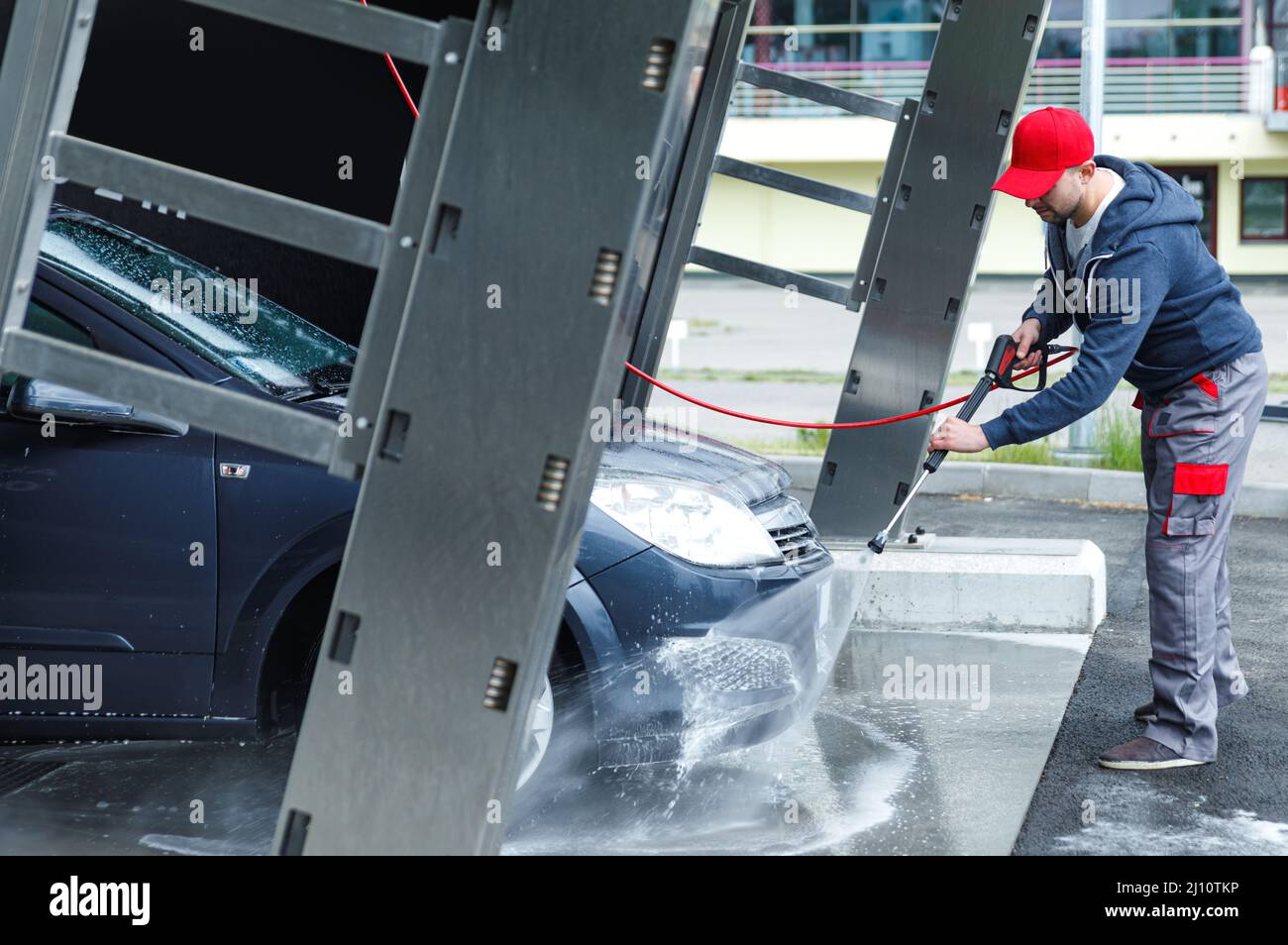 Car wash worker is washing client's car Stock Photo Alamy