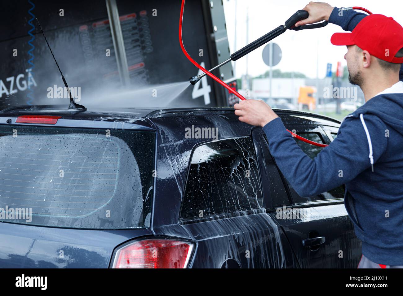 Car wash worker is washing client's car Stock Photo Alamy