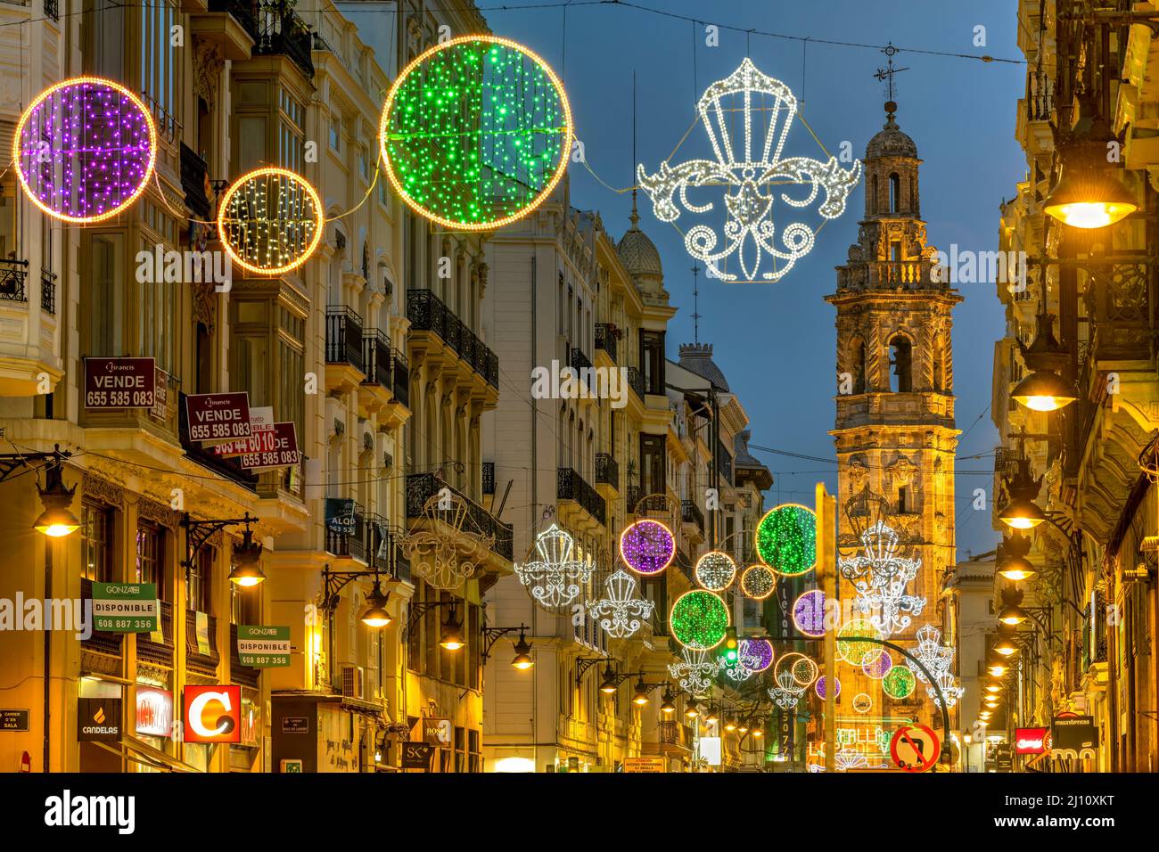 Street light decoration with Santa Catalina belfry in the background, Valencia, Spain Stock Photo