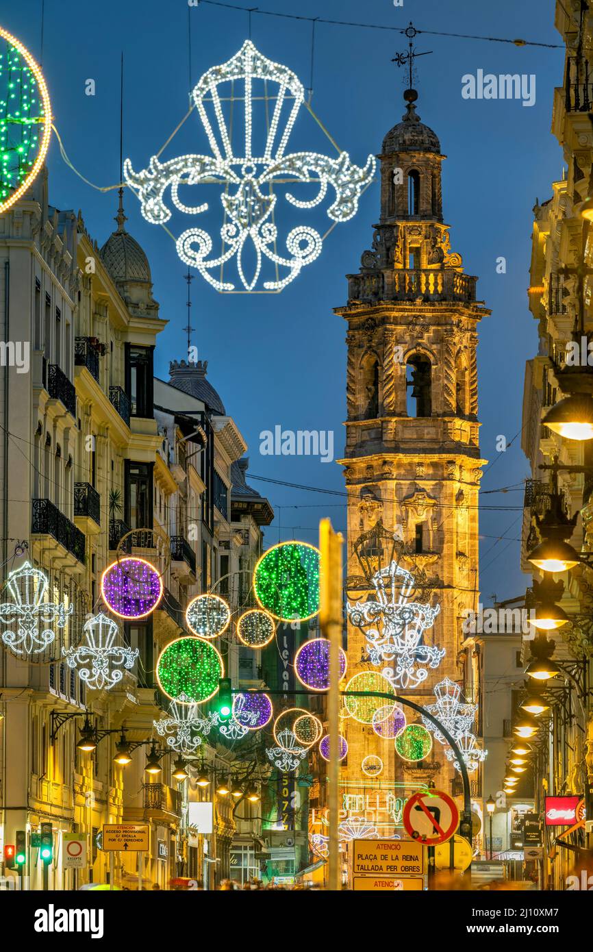 Street light decoration with Santa Catalina belfry in the background, Valencia, Spain Stock Photo