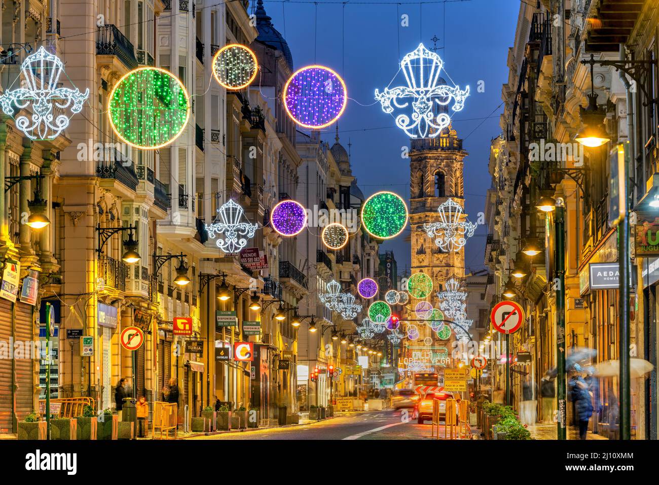 Street light decoration with Santa Catalina belfry in the background, Valencia, Spain Stock Photo