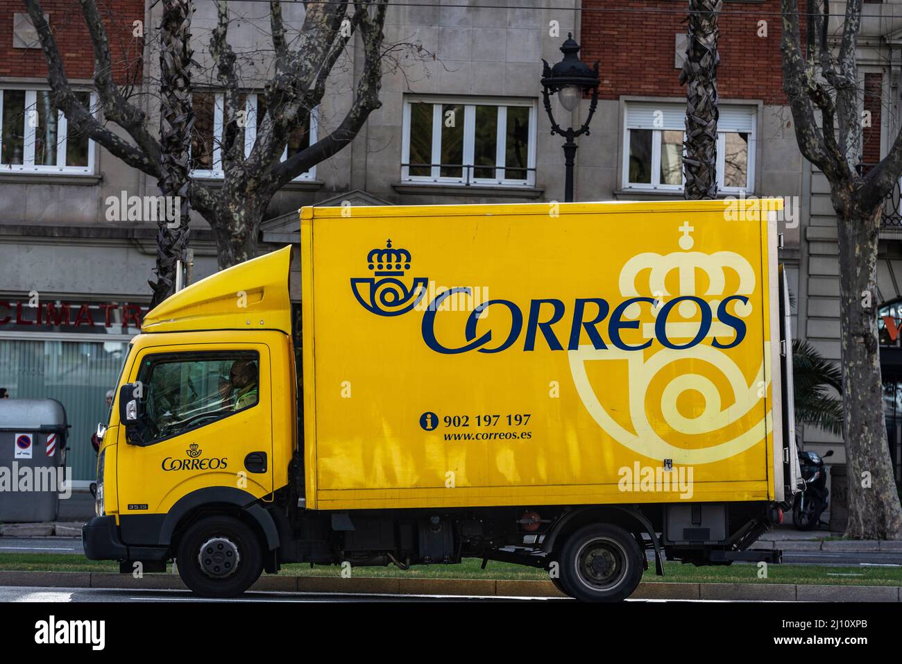 Barcelona, Spain - February 24, 2022: Post truck of Correos, state-owned company of postal service in Spain in Barcelona, Spain Stock Photo