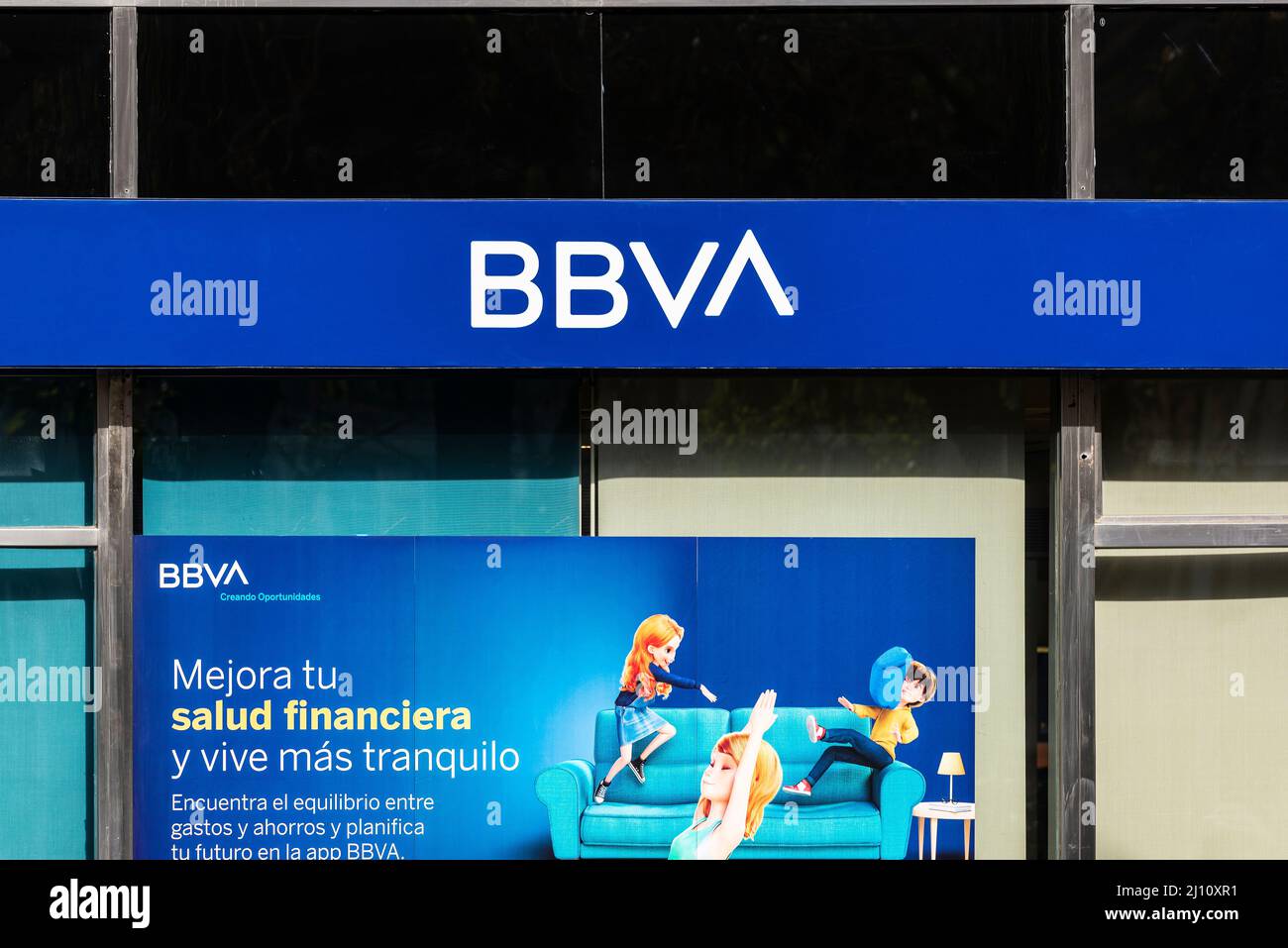 Barcelona, Spain - February 24, 2022: Facade and logo of the Banco Bilbao Vizcaya Argentaria or BBVA in Barcelona, Catalonia, Spain Stock Photo
