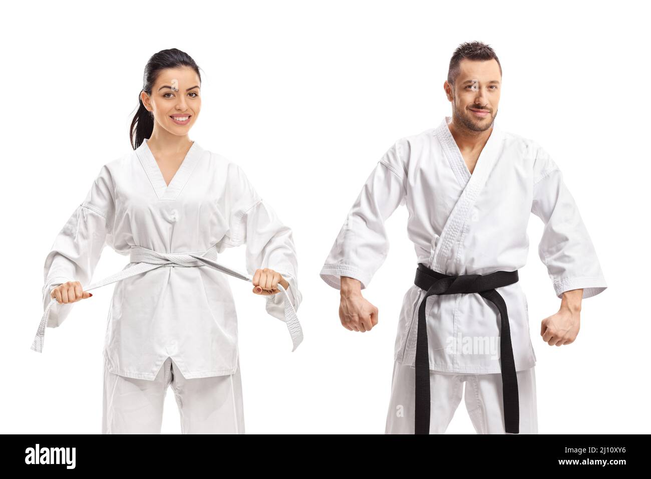 Woman with white karate belt and man with karate black belt isolated on