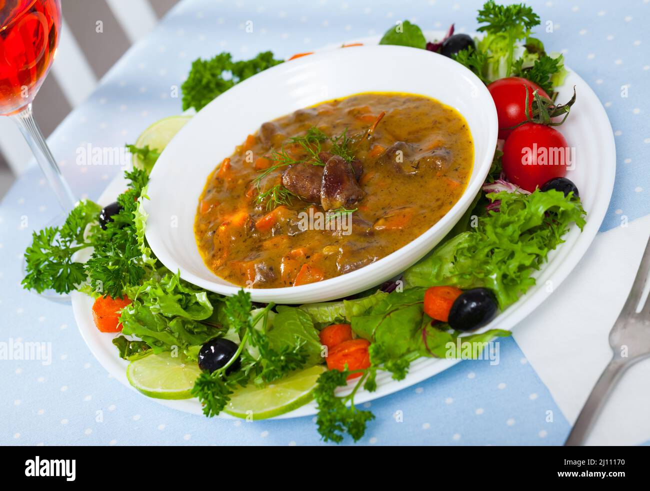 Delicious chicken hearts stew Stock Photo