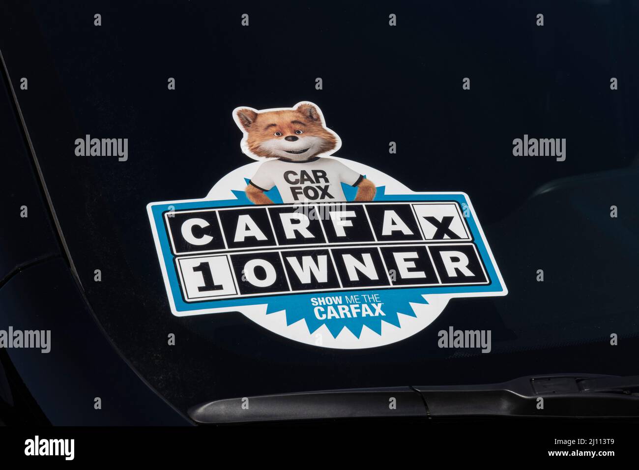 Lafayette - Circa March 2022: Carfax sticker on a used pre-owned vehicle. Carfax provides vehicle reports for prospective buyers that may reveal probl Stock Photo
