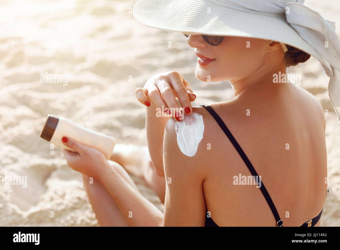 Beautiful Woman In Bikini Applying Sun Cream On Tanned Shoulder Sun Protection Skin And Body