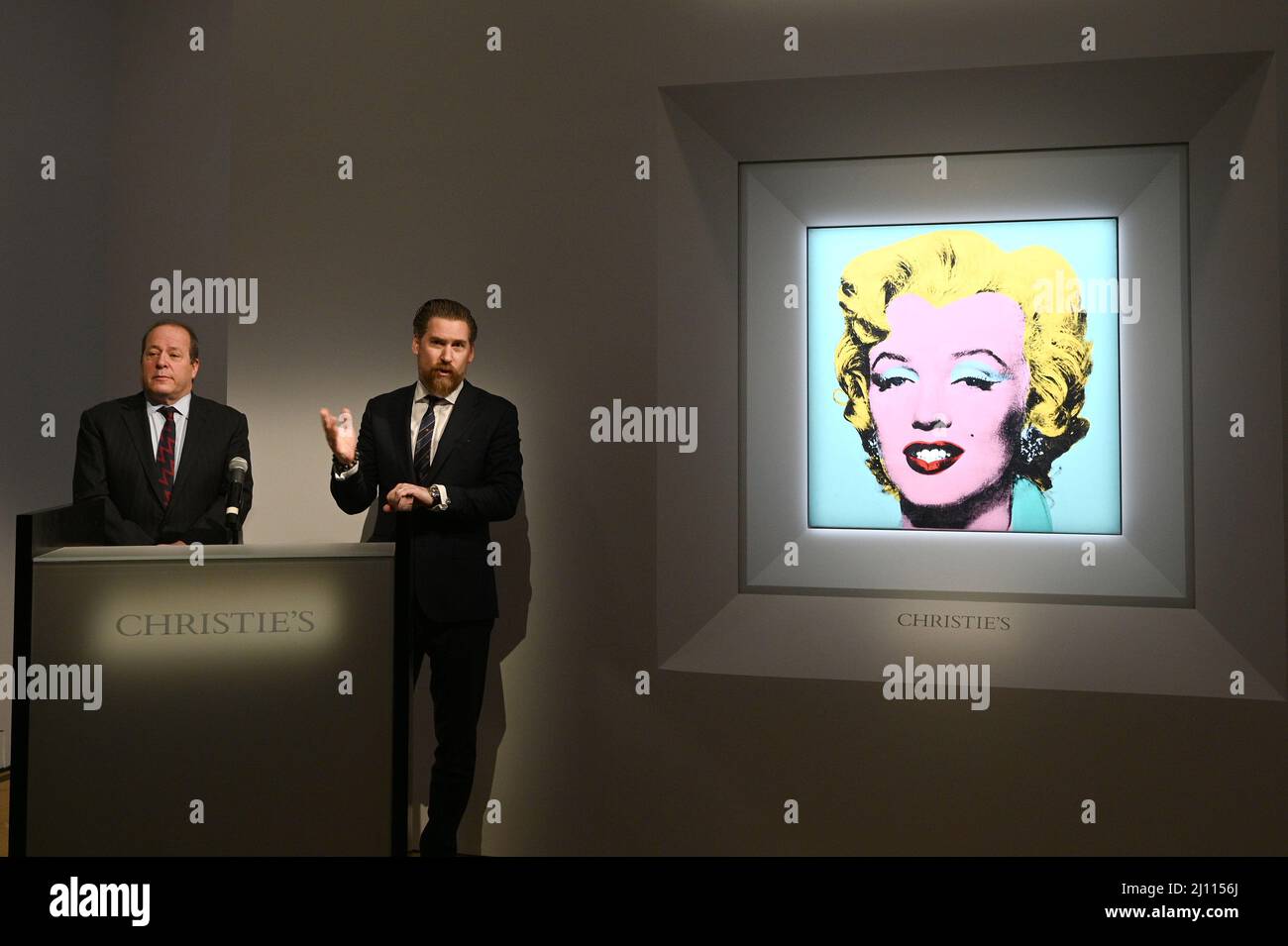 New York, USA. 21st Mar, 2022. Christie's Americas chairman Marc Porter (L) looks on as Christie's chairman, 20th and 21st Century Art, Alex Rotter announces that Christie's will offer will offer Andy Warhol's Shot Sage Blue Marilyn painting of Marilyn Monroe during its May Marquee Week of sales at Christie's in New York, NY, March 21, 2022. The work comes to Christie's from the Thomas and Doris Ammann Foundation Zurich and all proceeds of the sale will benefit the foundation for its charities. (Photo by Anthony Behar/Sipa USA) Credit: Sipa USA/Alamy Live News Stock Photo