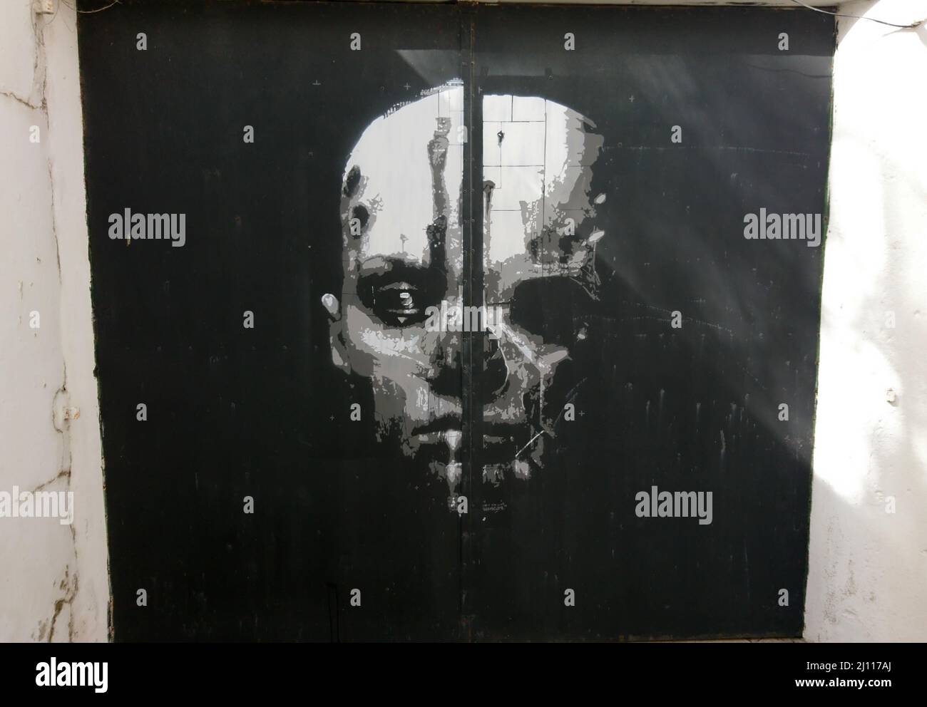 Graffiti face woman skull in Lagos Portugal Stock Photo