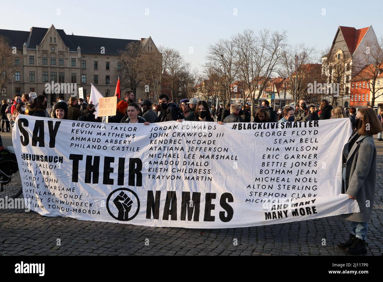 Erfurt, Germany. 21st Mar, 2022. Participants of a rally against racism stand on the Domplatz. March 21, 2022 is the International Day against Racism and has the motto 'Racism is everyday life - racism is also your problem!' Credit: Bodo Schackow/dpa-Zentralbild/dpa/Alamy Live News Stock Photo
