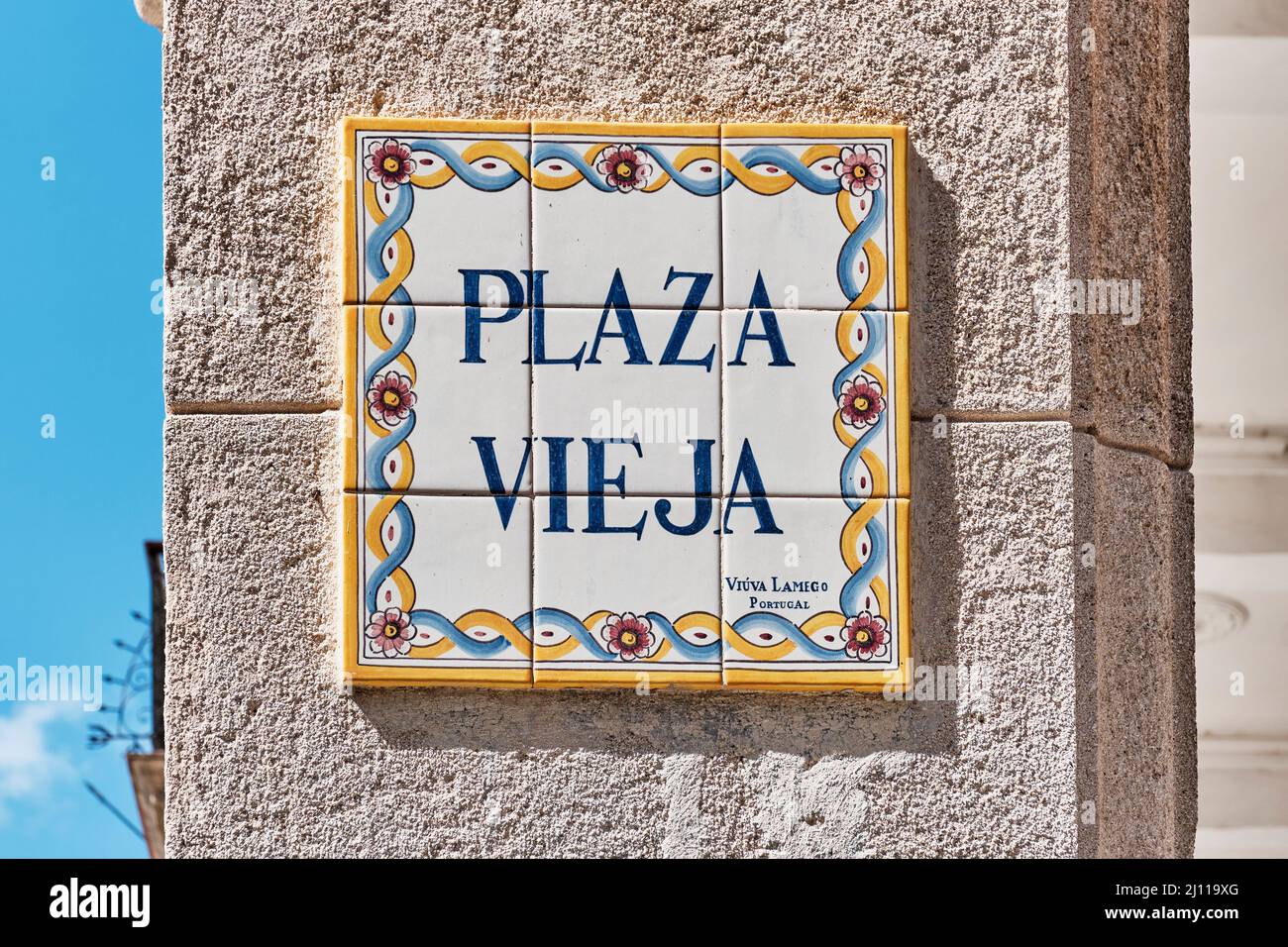 Colorful plaque with name of city square in Spanish. In English Old