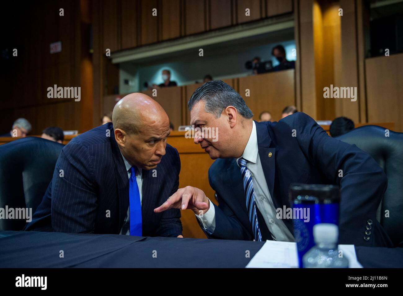 United States Senator Cory Booker (Democrat of New Jersey), left, confers with United States Senator Alex Padilla (Democrat of California) as Judge Ketanji Brown Jackson appears for the first day of her Senate nomination hearings to be an Associate Justice of the Supreme Court of the United States, in the Hart Senate Office Building in Washington, DC, Monday, March 21, 2022. Credit: Rod Lamkey/CNP /MediaPunch Stock Photo