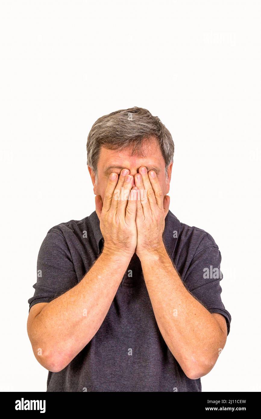 man slapping hands in front of the face Stock Photo