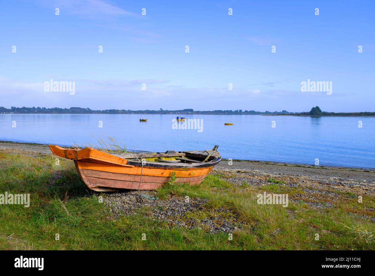 Small boat moored in the Chacao Channel. Chiloé. Los Lagos Region. Chile. Stock Photo