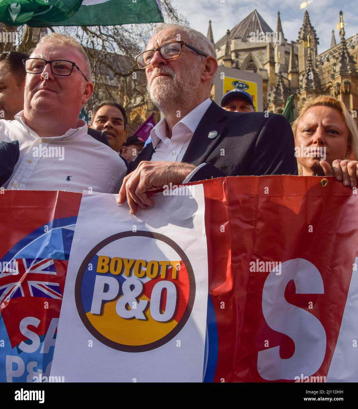 London, UK. 21st March 2022. Labour MP Jeremy Corbyn joins the protesters outside Parliament. P&O Ferries staff and RMT Union members marched from the headquarters of DP World, the company which owns P&O, to Parliament, after 800 UK staff were fired and replaced by agency workers. Credit: Vuk Valcic/Alamy Live News Stock Photo