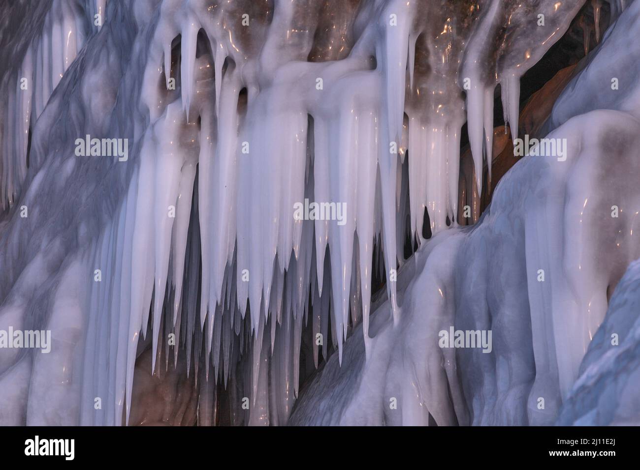 Beautiful winter nature background with long icicles Stock Photo