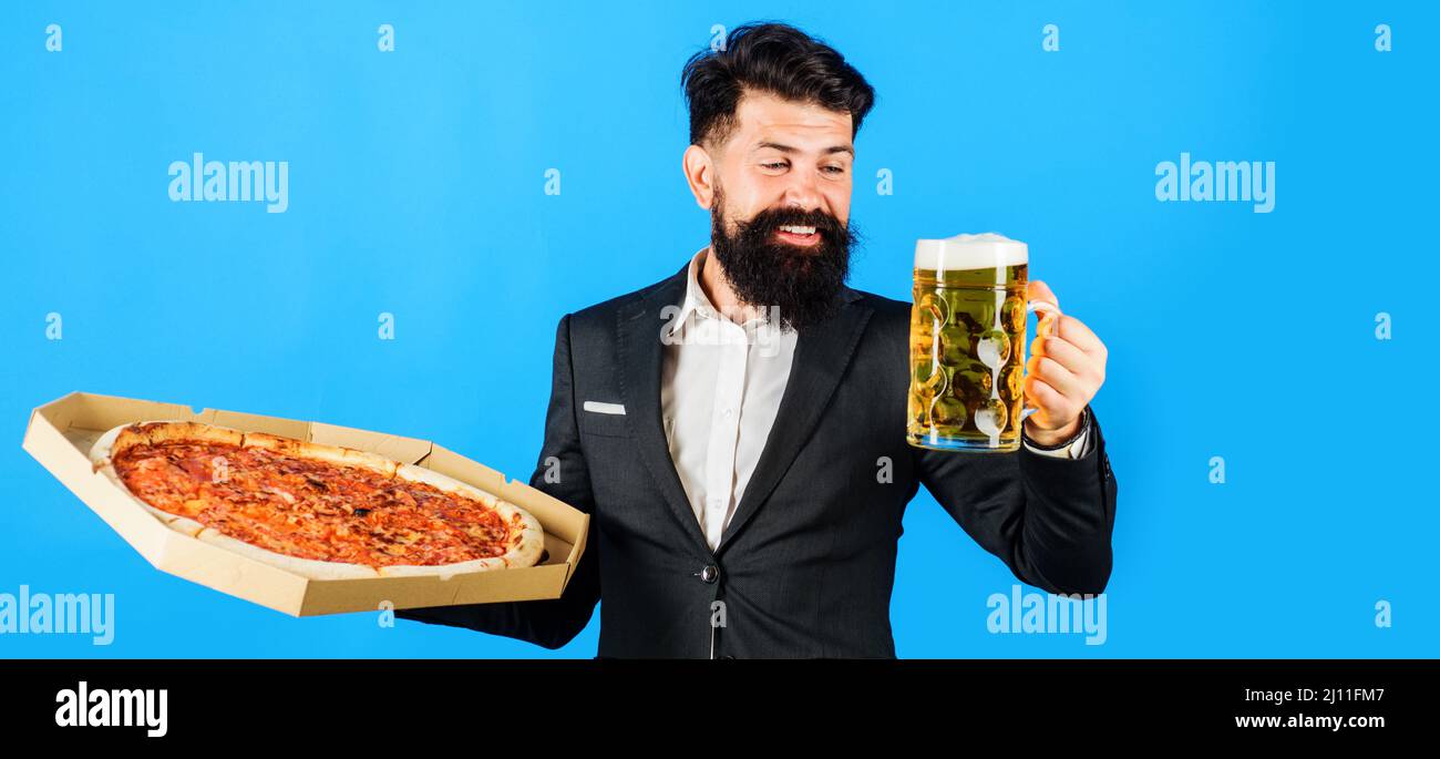 Restaurant or pizzeria. Smiling man with pizza in box and mug of beer