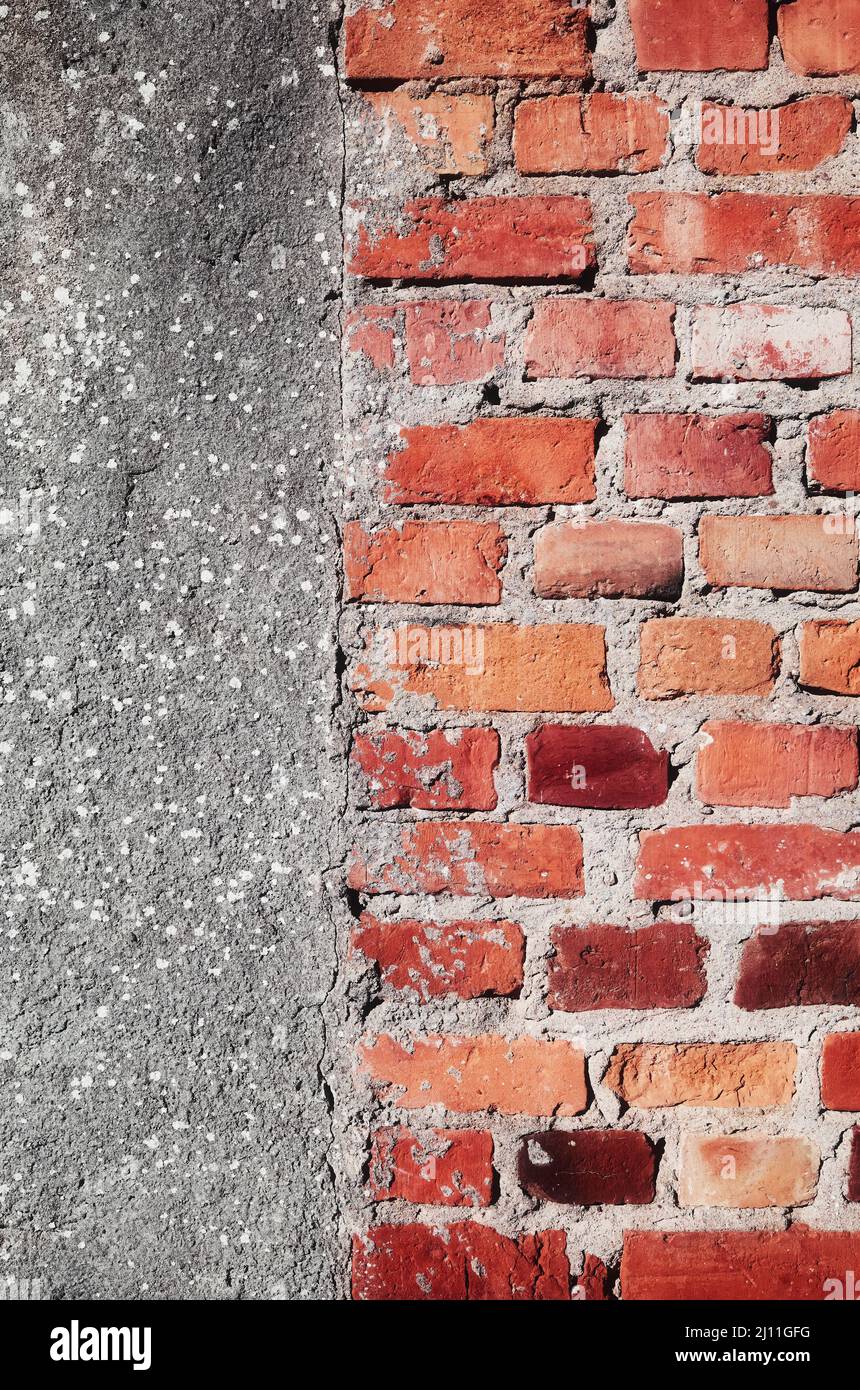 Rough old concrete and brick wall background. Stock Photo