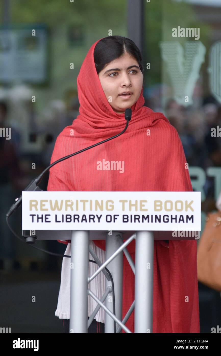 BIRMINGHAM, England, 3 September 2013 - Malala Yousafzai, born on July 12, 1997, in Mingora, the largest city in the Swat Valley in what is now the Khyber Pakhtunkhwa Province of Pakistan. The educational activist attended the opening ceremony for the Library of Birmingham with her father, Ziauddin Yousafzai. Malala, who was shot by the Taliban in Pakistan in October 2012 for promoting girls' right to education, has been living in Birmingham with her family since being flown from Pakistan for emergency treatment at Queen Elizabeth Hospital. Stock Photo