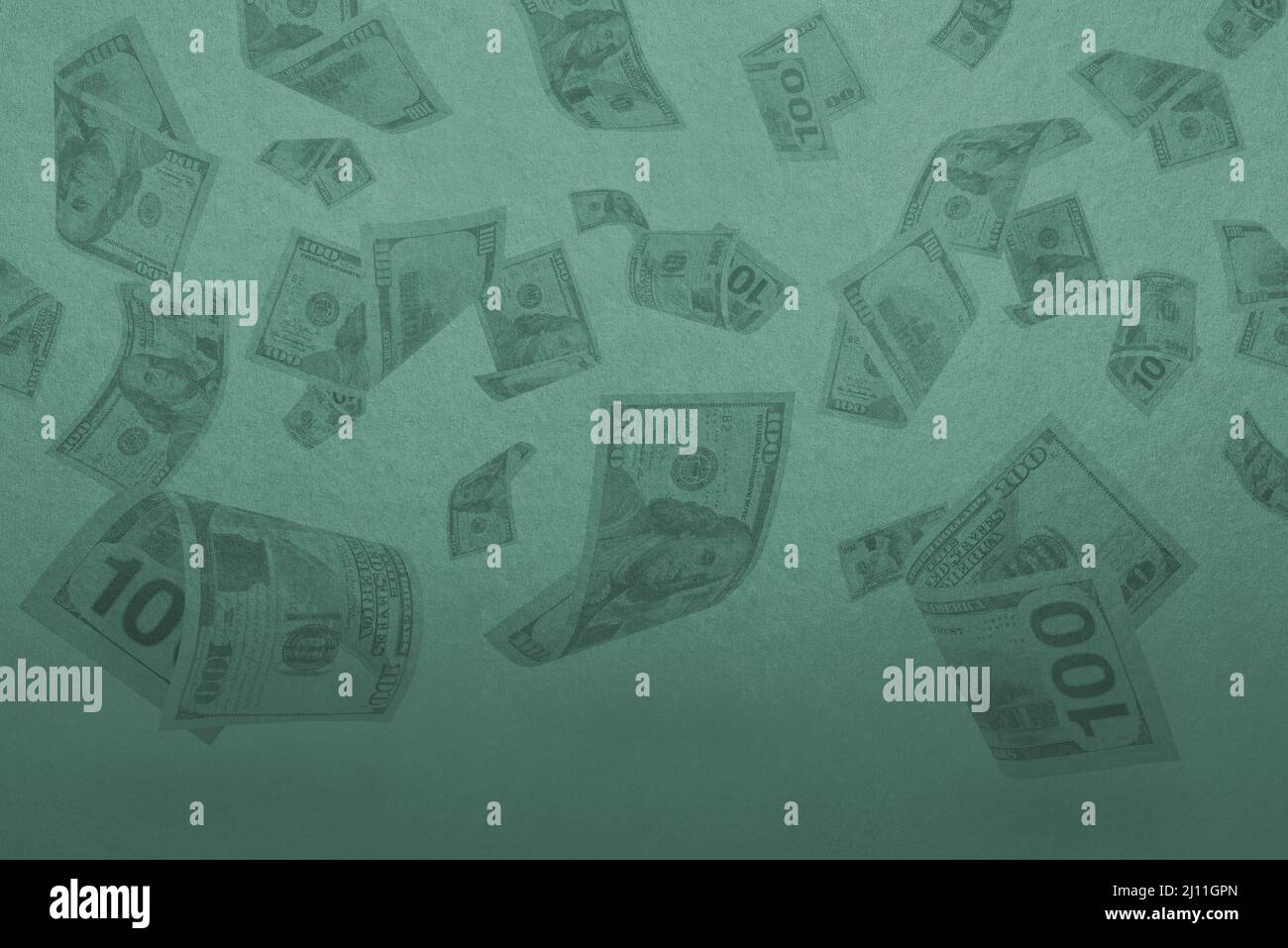 Money is falling from the sky. Falling banknotes on a green background ...