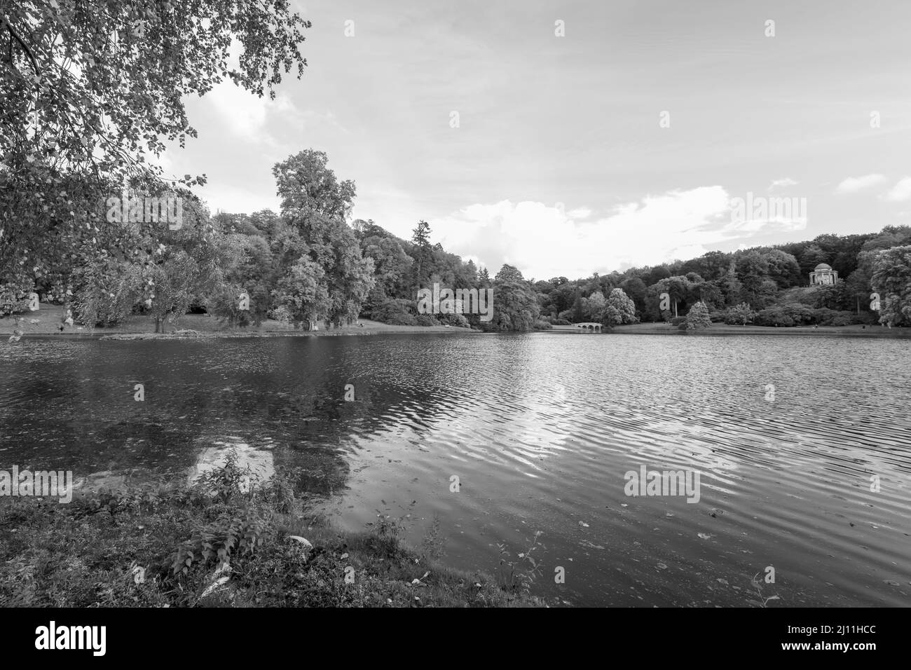 View of the autumn colours around the lake at Stourhead gardens in Wiltshire Stock Photo