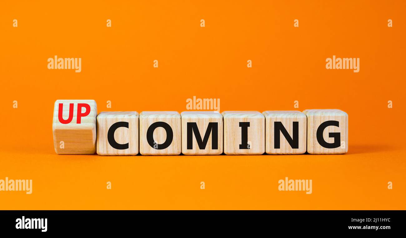 Coming or upcoming symbol Turned wooden cubes and changed the word