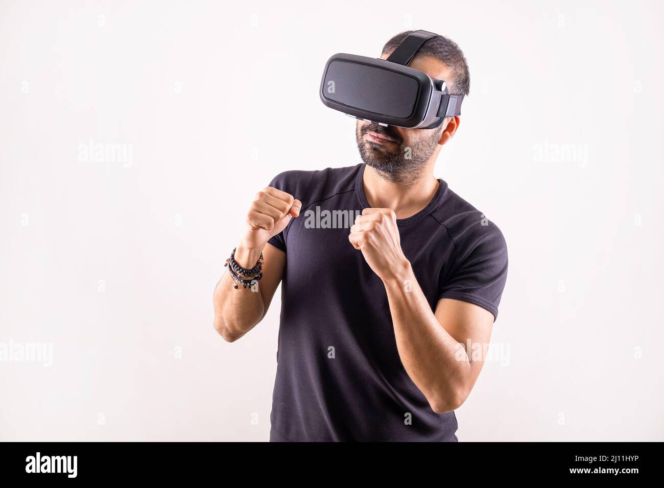 Virtual reality workout, sport game. young man with VR glasses boxing