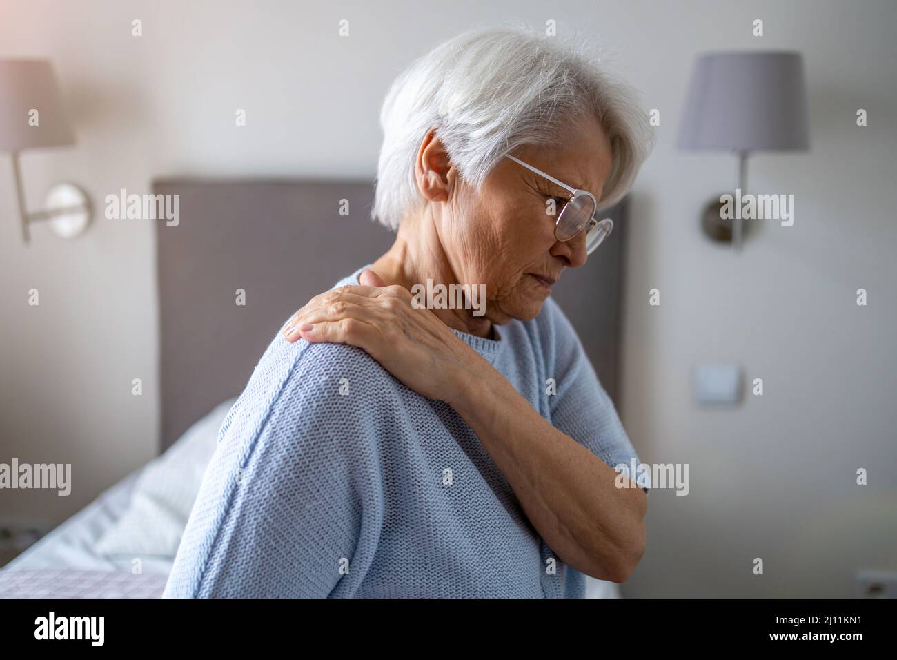 Senior woman suffering from back pain Stock Photo