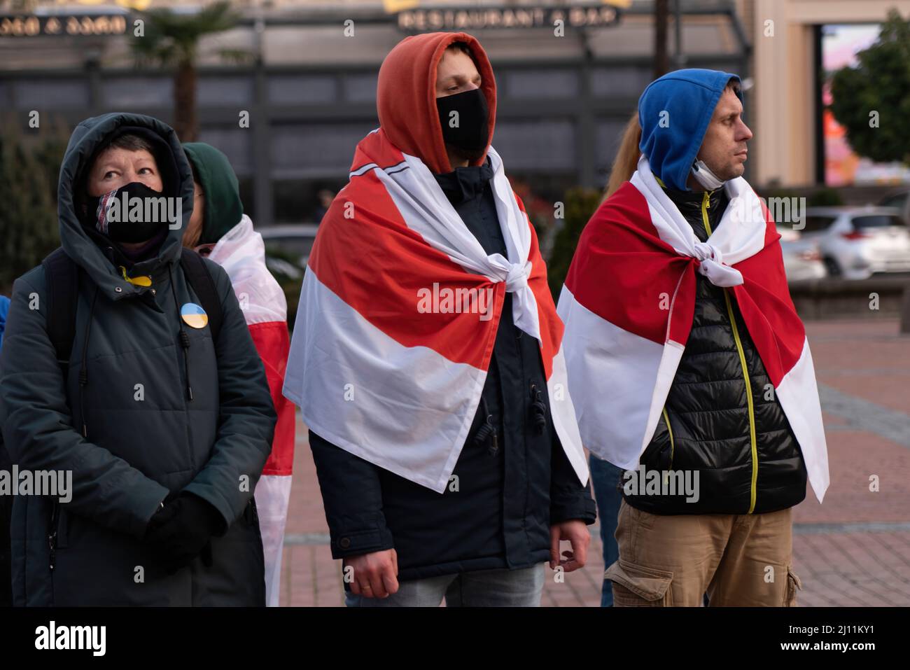 Batumi, Georgia - March 21, 2022: a man with the flag of Belarus on his shoulders Stock Photo