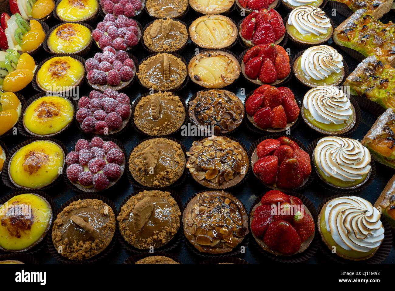 Tarlets Cake Artisan baker and pastry chef. Detail of mixed tartlets and cakes in a ...