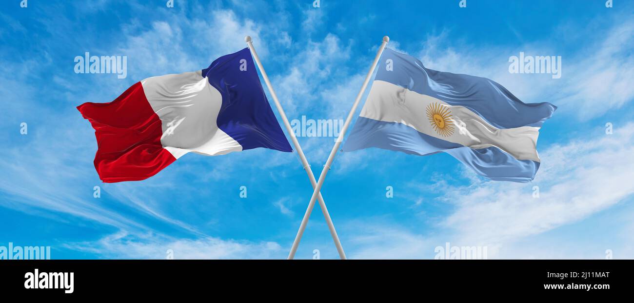 crossed national flags of France and Argentina flag waving in the wind ...
