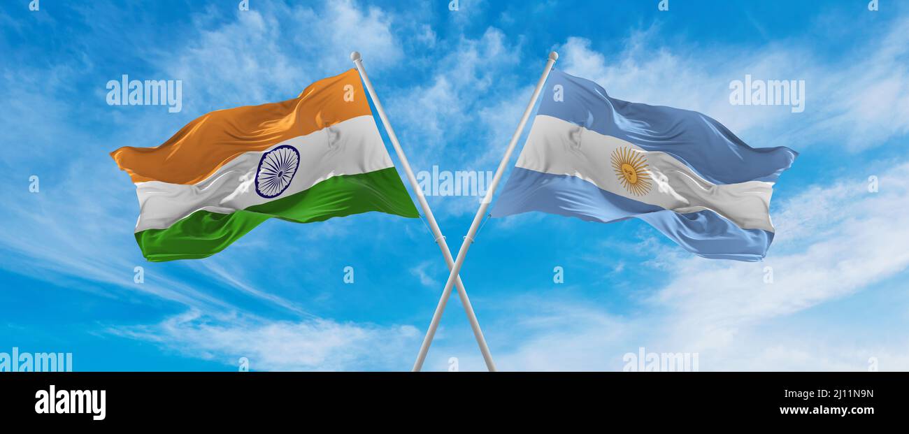 crossed national flags of India and Argentina flag waving in the wind ...