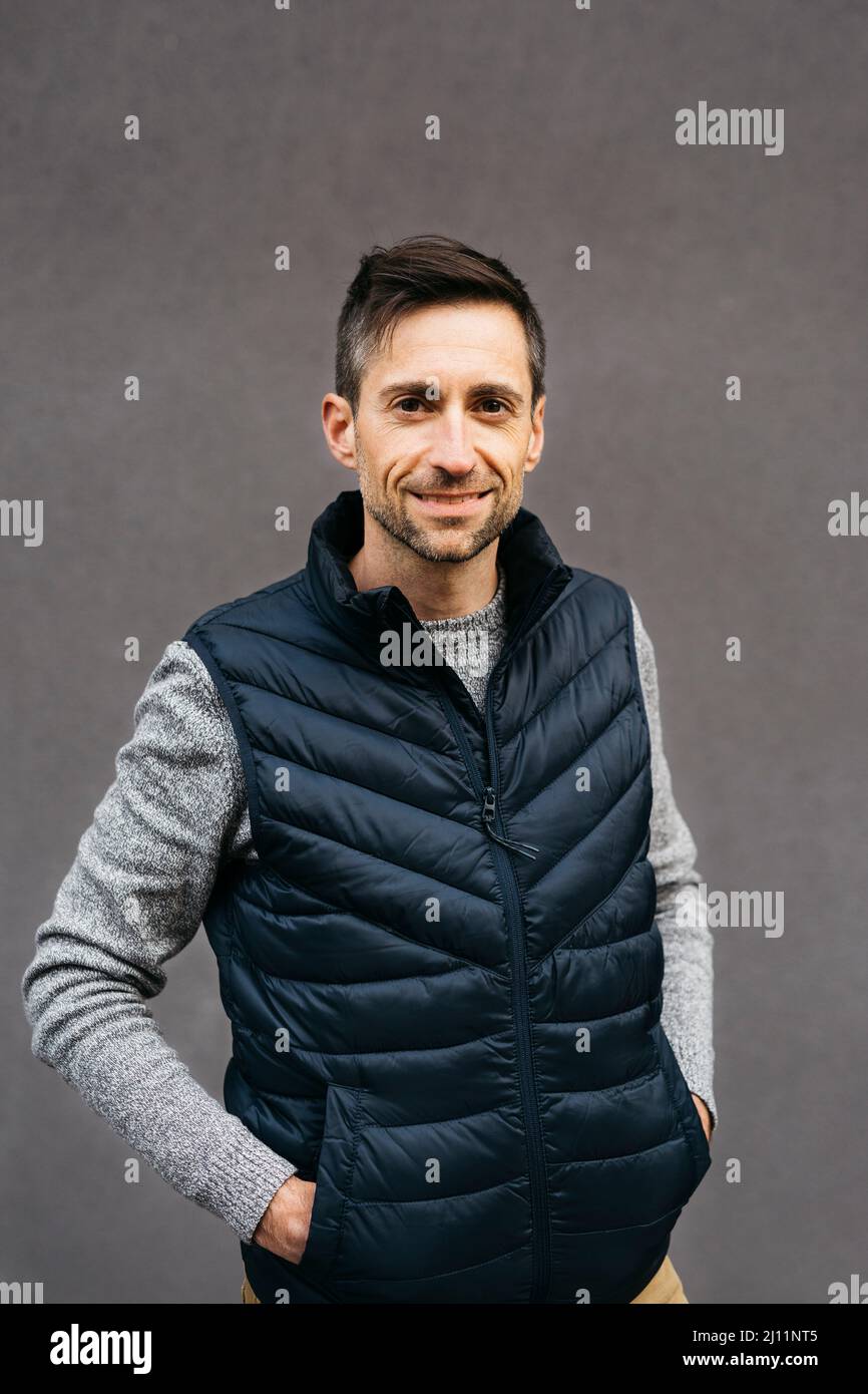 Portrait of a man in casual clothes, against a grey background Stock Photo
