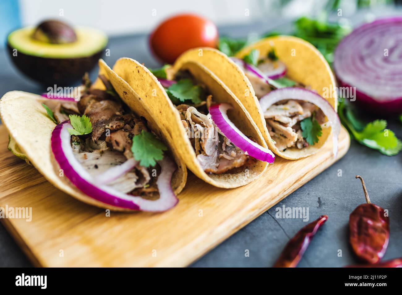 mexican street tacos with lemon, sauce, onion and cilantro Traditional