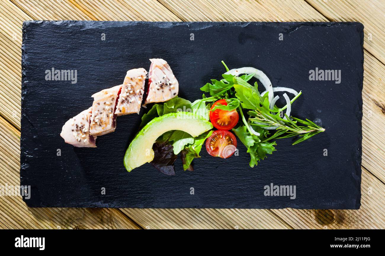 Top view of tuna tataki with avocado and greens Stock Photo Alamy