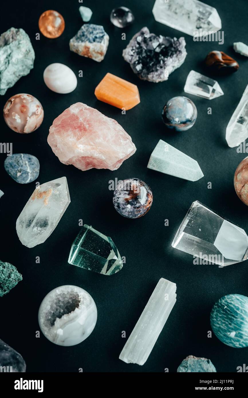 Healing minerals, gemstones and crystal stones on black background Stock Photo