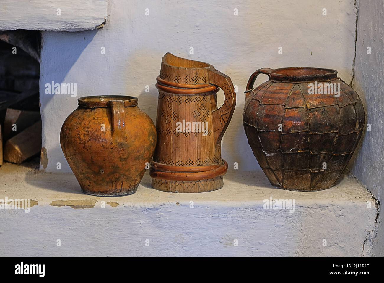 Clay traditional pot in vintage style. Ukrainian cultural national style. Installation in museums of traditional rural household items. Stock Photo