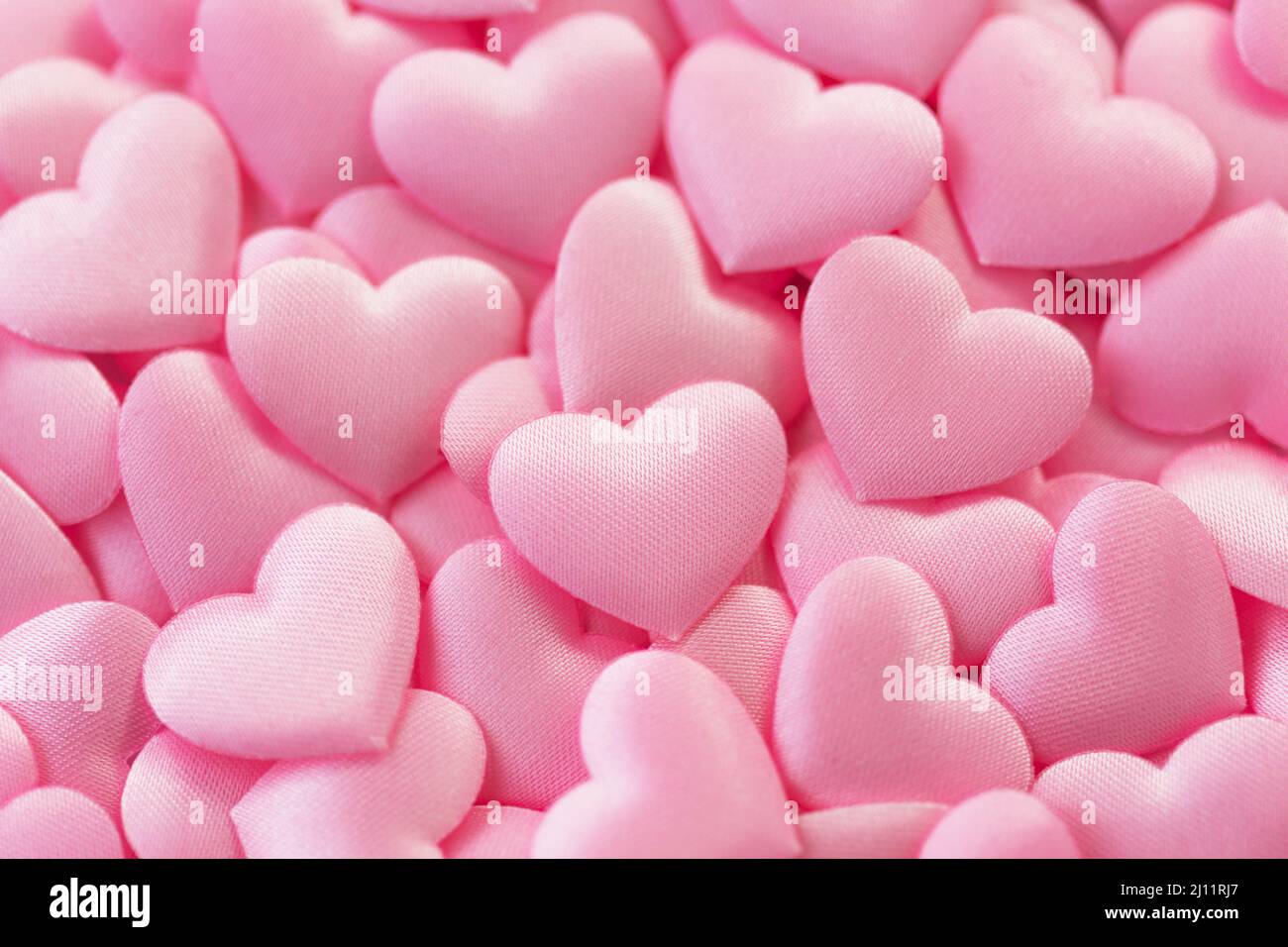 Tiny pink hearts as background. Happy Valentine's Day background Stock Photo